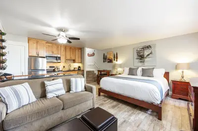 a living room with a bed and a couch at 125 Bldg B condo in Truckee