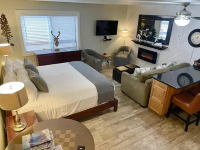 a bedroom with a bed and a living room at 125 Bldg B condo in Truckee