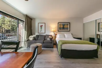 a hotel room with a bed and a couch at 234 Bldg C condo in Truckee