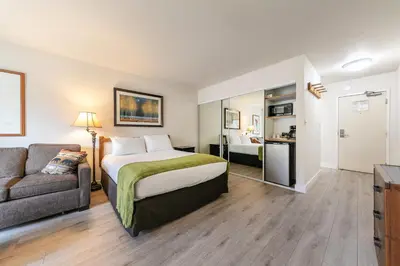 a hotel room with a bed and a couch at 234 Bldg C condo in Truckee