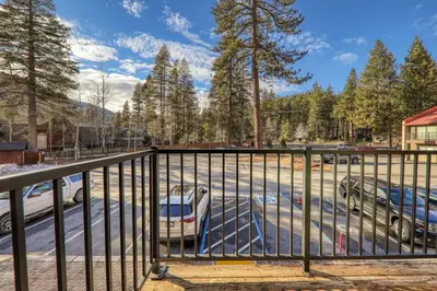 a fence with cars parked in a parking lot at 234 Bldg C condo in Truckee