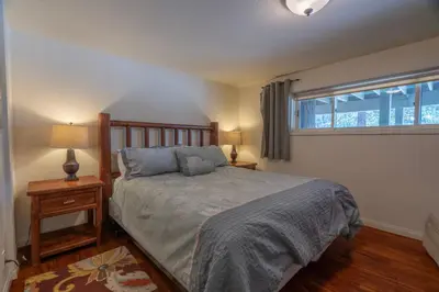 a bedroom with a large bed and a window at RR-Villa Lago STR AP 18-003 in June Lake