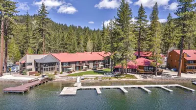 an aerial view of a resort with a dock in the water at 113 Bldg B studio in Truckee