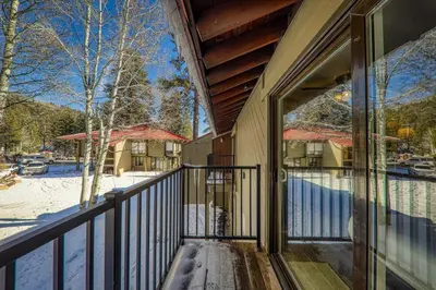 a balcony of a house with snow on the ground at 212 Bldg B condo in Truckee