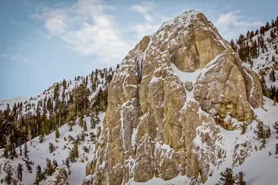 a large rocky mountain with snow on it at Mammoth Point 119 in Mammoth Lakes