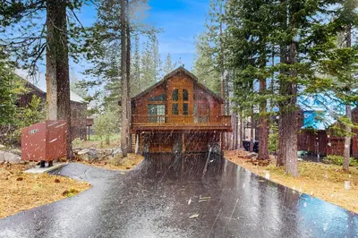 a house in the middle of a road in the woods at Chill on the Hill in Truckee