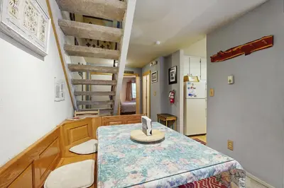 a room with a table with a laptop on it at Woodstock and Snoopy in Incline Village