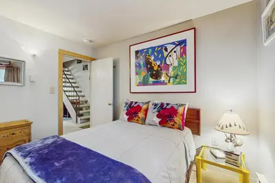 a bedroom with a bed and a painting on the wall at Woodstock and Snoopy in Incline Village