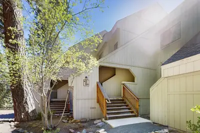 a building with stairs and a tree at Woodstock and Snoopy in Incline Village