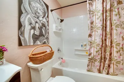 a bathroom with a toilet and a shower curtain at 1 Mi to Reno-Sparks Family Retreat with Fireplace! in Reno
