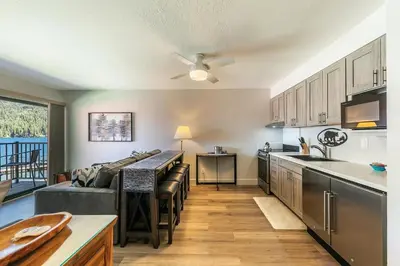 a kitchen and living room with a couch and a table at 244 Bldg C condo in Truckee