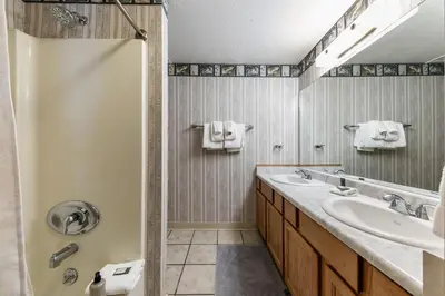 a bathroom with a sink and a mirror at 117 Bldg B condo in Truckee