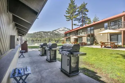 a row of trash cans sitting outside of a building at 231 Bldg C condo in Truckee