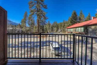 a gate with a car parked outside of a building at 231 Bldg C condo in Truckee