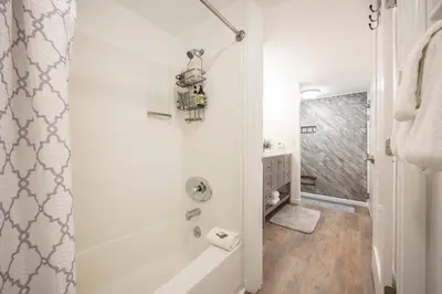 a bathroom with a shower and a bath tub at 124 Bldg B studio in Truckee