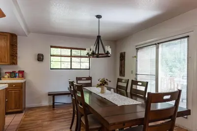 a kitchen and dining room with a table and chairs at Inside Yosemite Mountain Beauty in Yosemite West