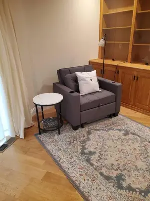 a living room with a couch and a table at Grass Valley Oasis - Spacious Family Retreat Near Rollins Lake in Grass Valley
