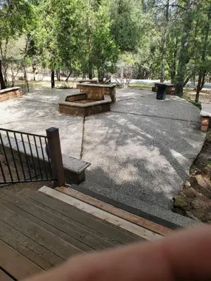 two picnic tables and benches in a park at Grass Valley Oasis - Spacious Family Retreat Near Rollins Lake in Grass Valley