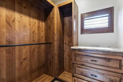 a bathroom with wooden walls and a window at Reno Basecamp 2 King Suites, Walk to Food and Fun in Reno