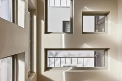 a room with three windows and a door at Reno Basecamp 2 King Suites, Walk to Food and Fun in Reno