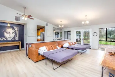 a living room with two beds and a couch at Grand Riverside Retreat - Private Walkway to the River in Three Rivers