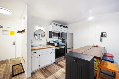 a kitchen with white cabinets and a counter top at 114 Bldg B condo in Truckee