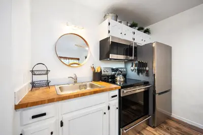 a kitchen with a sink and a stainless steel refrigerator at 114 Bldg B condo in Truckee