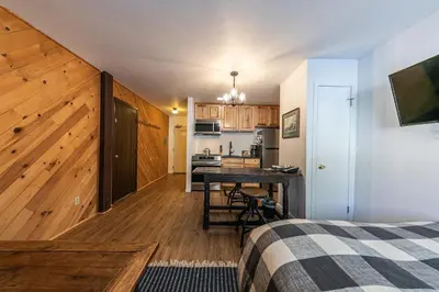 a bedroom with a kitchen and a desk in a room at 112 Bldg B condo in Truckee
