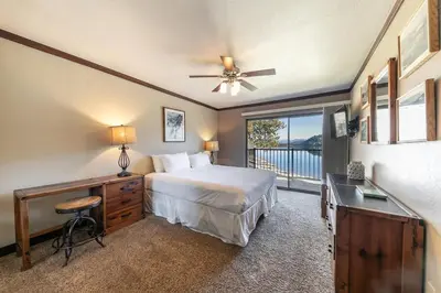 a bedroom with a bed and a desk and a window at 247 Bldg C condo in Truckee
