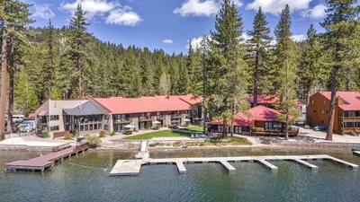 an image of a resort with a dock in the water at 247 Bldg C condo in Truckee