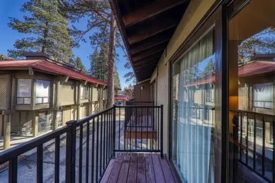 a porch of a house with a balcony at 215 Bldg B condo in Truckee