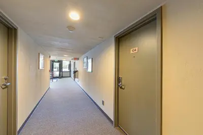 an empty hallway with doors in an office building at 134 Bldg C studio in Truckee