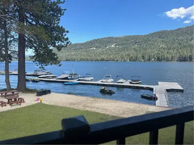 a dock with boats in a body of water at 245 Bldg C condo in Truckee