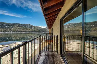 a balcony of a house with a view of a lake at 246 Bldg C condo in Truckee