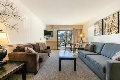 a living room with a couch and a table at 222 Bldg B condo in Truckee