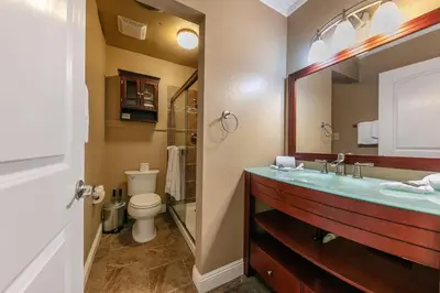 a bathroom with a sink and a toilet and a mirror at Cozy Deluxe Studio #131 at Donner Lake Village condo in Truckee