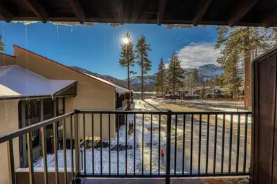a balcony of a building with a view of the mountains at 224 Bldg B condo in Truckee
