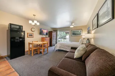 a living room with a couch and a bedroom at 217 Bldg B condo in Truckee