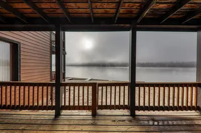 a view of a lake from the porch of a cabin at 154 Bldg D townhouse in Truckee