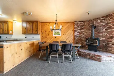 a kitchen with a table and chairs and a stove at 154 Bldg D townhouse in Truckee