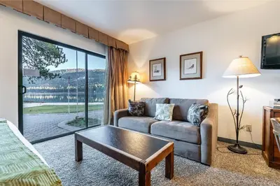 a living room with a couch and a table at 144 Bldg C condo in Truckee