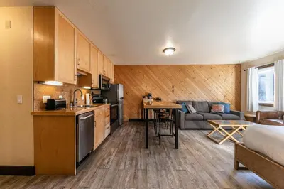 a room with a kitchen and a living room at 122 Bldg B studio in Truckee