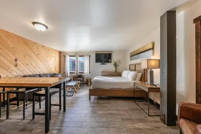 a hotel room with a bed and a table at 122 Bldg B studio in Truckee