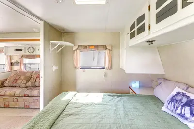 a small room with a bed and a couch at 11 Mi to Heavenly Mtn Resort Getaway with Mtn Views in Gardnerville