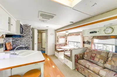 an rv kitchen and living room with a couch at 11 Mi to Heavenly Mtn Resort Getaway with Mtn Views in Gardnerville
