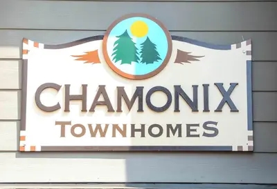 a sign for a chamonix township sign on a building at Chamonix #093 - Near Skiing Hiking & More in Mammoth Lakes