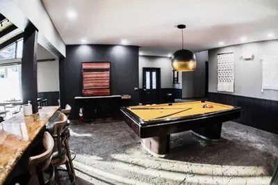 a billiard room with a pool table and a bar at Chamonix #093 - Near Skiing Hiking & More in Mammoth Lakes