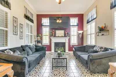 a living room with two couches and a fireplace at Golf, Fish and More Cozy Safari Unit in Atwater! in Atwater