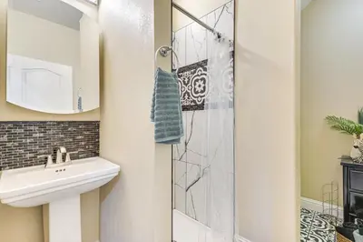 a bathroom with a sink and a shower at Golf, Fish and More Cozy Safari Unit in Atwater! in Atwater