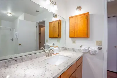 a bathroom with a sink and a mirror at Serene Riverfront Home - 150 yds from the River in Three Rivers